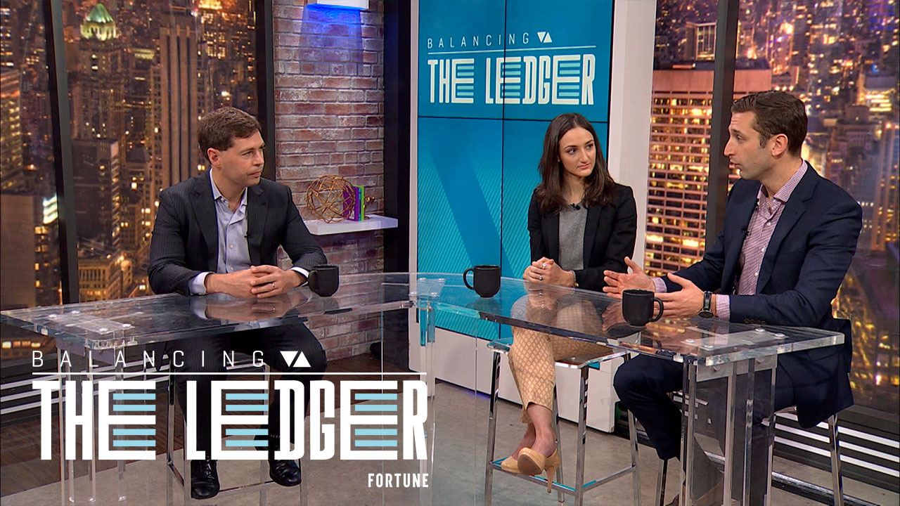Coinbase general manager Adam White (right) joins Fortune's Jeff Roberts and Jen Wieczner on "Balancing the Ledger." White says Coinbase's Bitcoin exchange is preparing for Wall Street to invest tens of billions of dollars in cryptocurrency.
