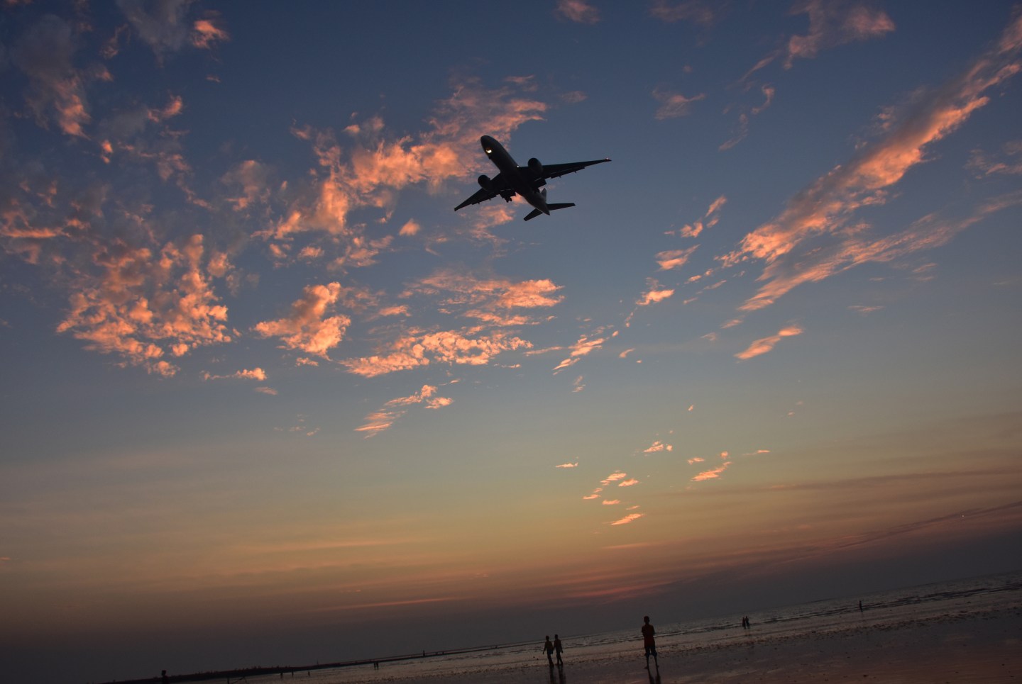 A plane seen flying over the Juhu Beach in Mumbai