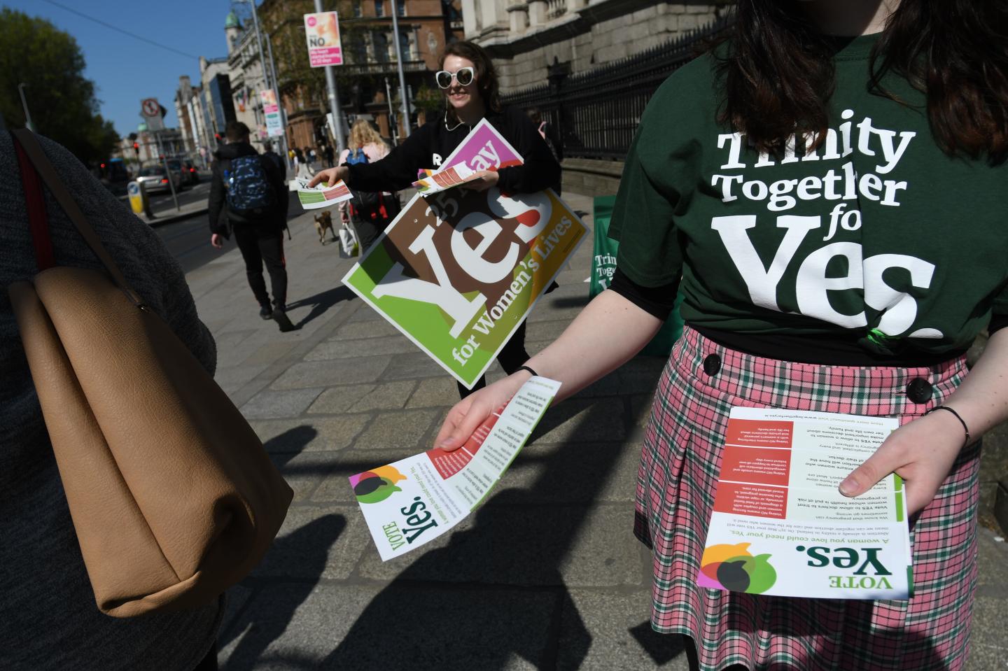Activists from the 'Trinity Together for Yes' campaign canvass in front of Trinity College, urging a 'yes' vote.