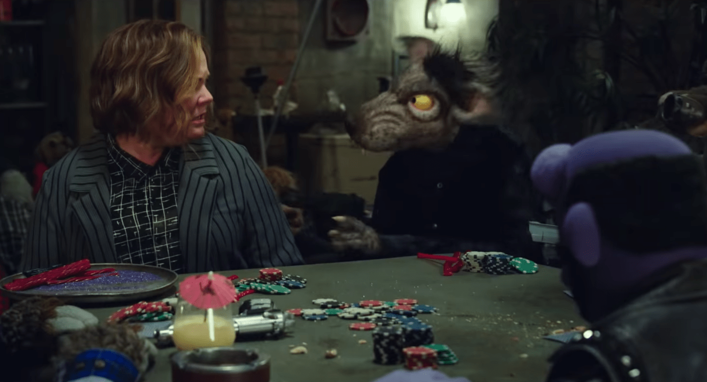 melissa mccarthy and puppet with gun