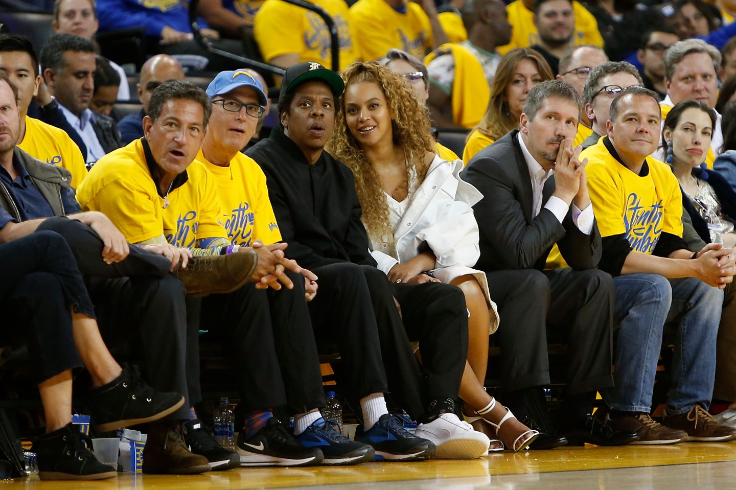 Jay-Z sits next to Beyonce on the front row at a basketball game and looks surprised
