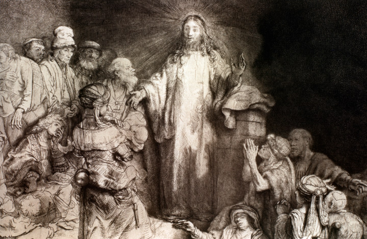 Jesus Christ heals the sick in this painting by Rembrandt Harmensz van Rijn.