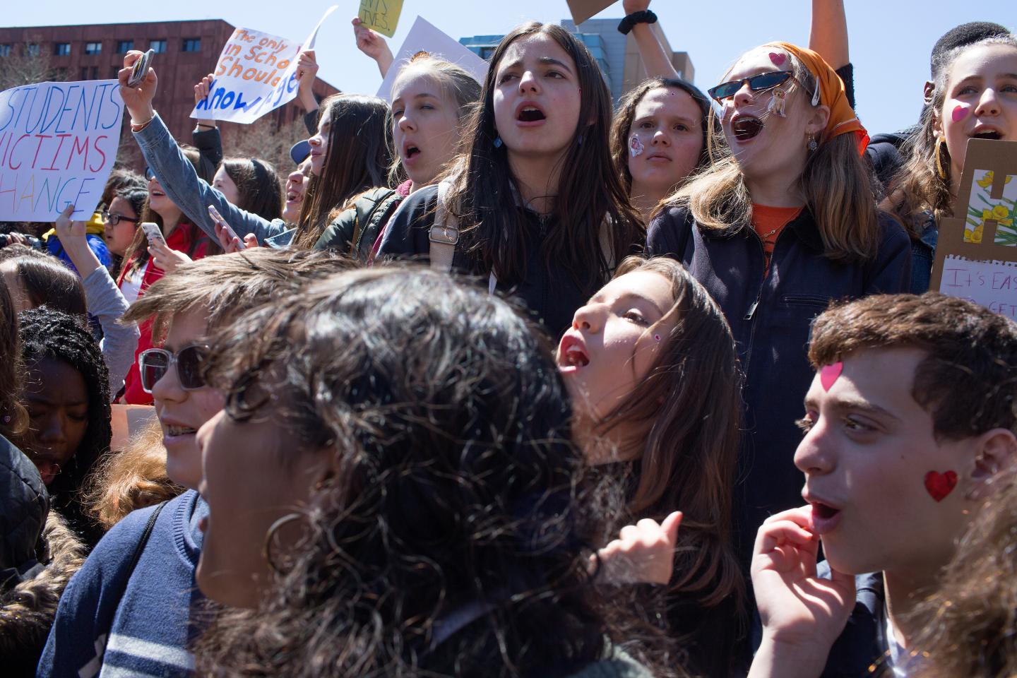 On the anniversary of the Columbine shooting, thousands of New York teenagers walk out of school to attend a gun control rally.