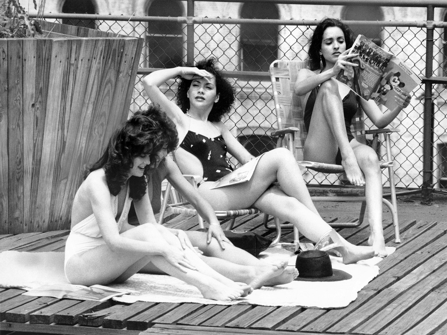 Upon the roof of a building on East 39th Street, models (lef