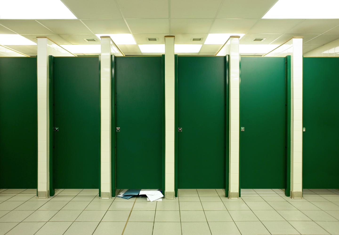 Paperwork in toilet cubicle