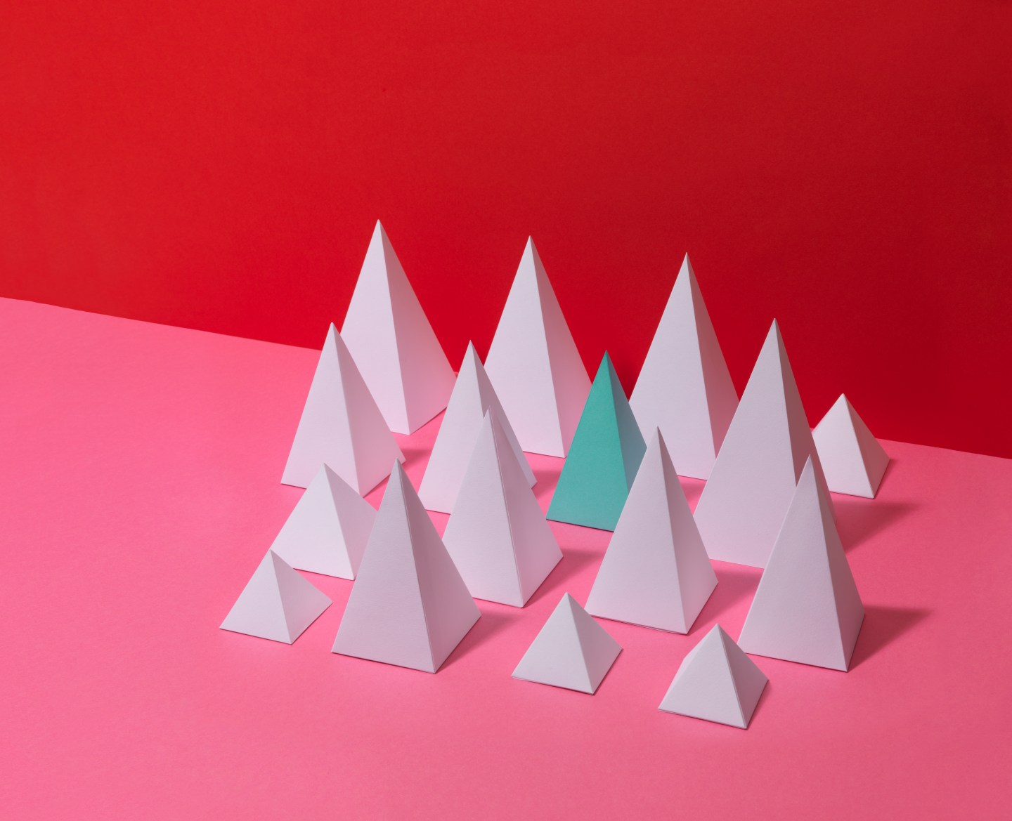 White Pyramids on Red Background