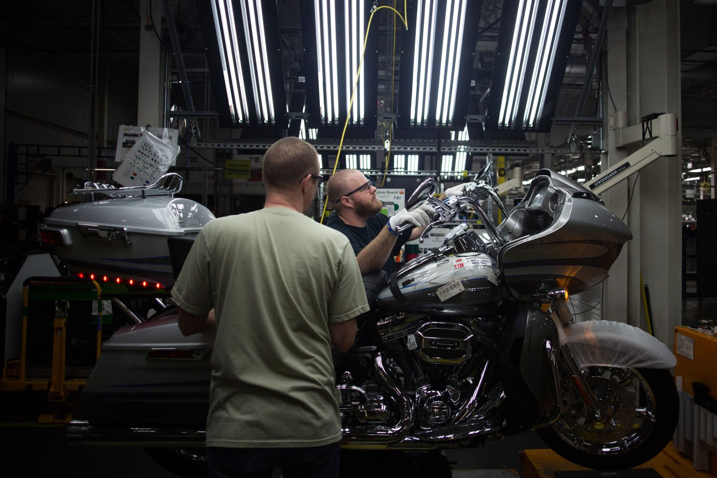 Employees work on the assembly line at the Harley-Davidson Inc. manufacturing facility in York, Pennsylvania, U.S., in 2015.