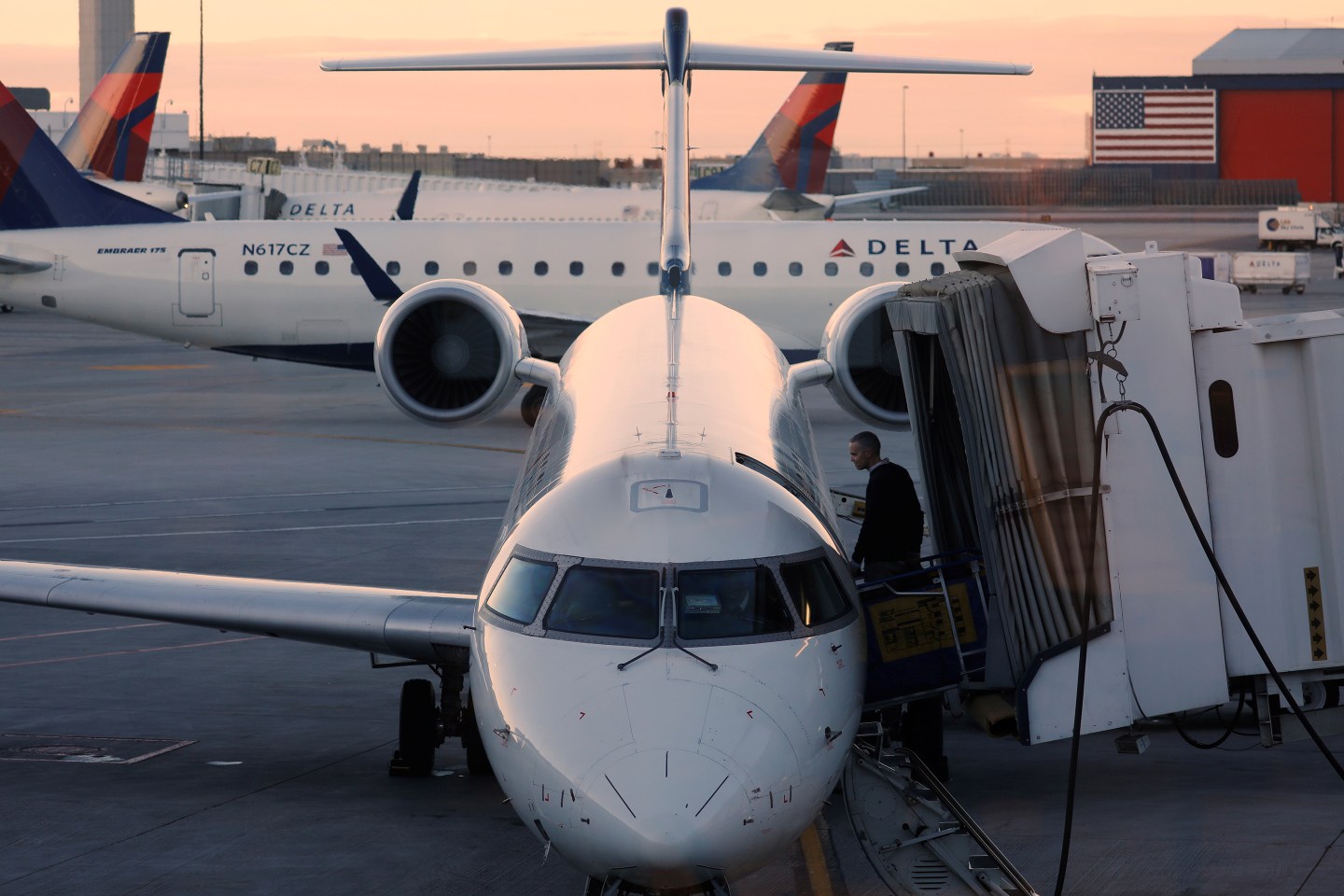 A passenger boards his Delta Airlines flight at the airport in Salt Lake City