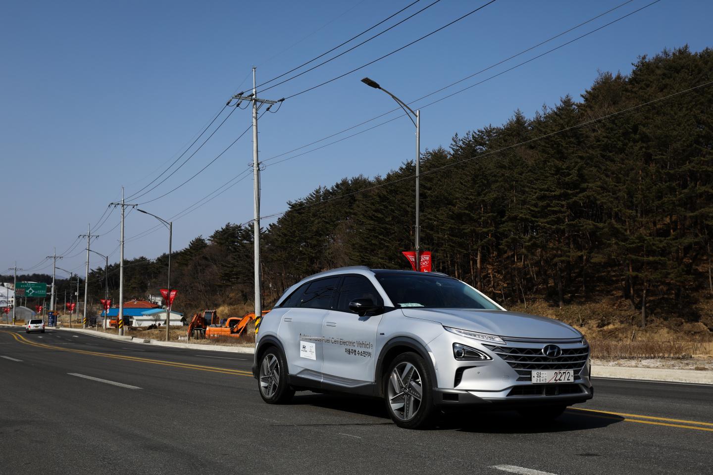 A Hyundai Nexo autonomous fuel cell electric vehicle travels along a road during a test drive in Pyeongchang, South Korea.