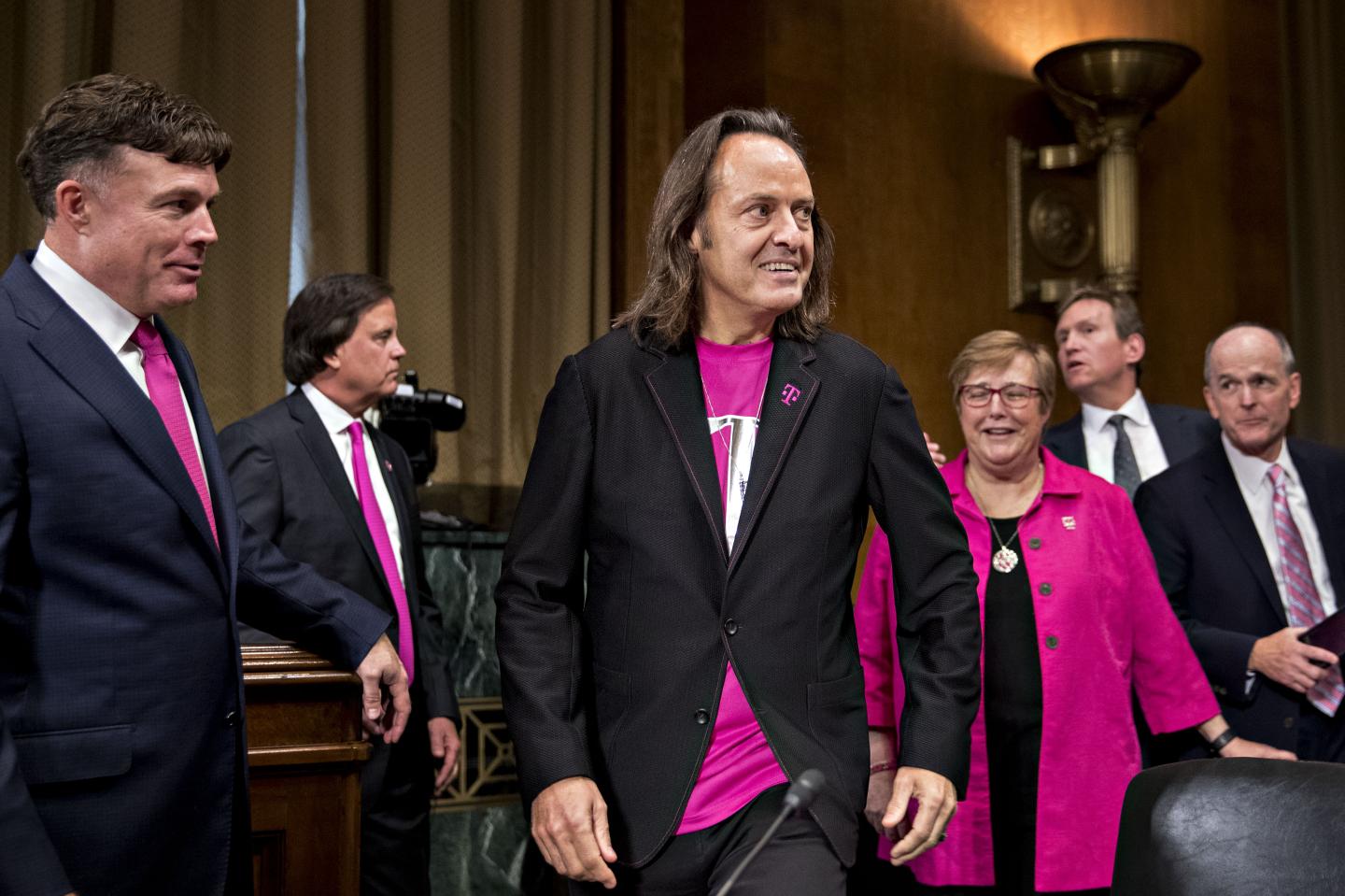 T-Mobile CEO John Legere arrives at a Senate hearing to testify about his proposed merger with Sprint.