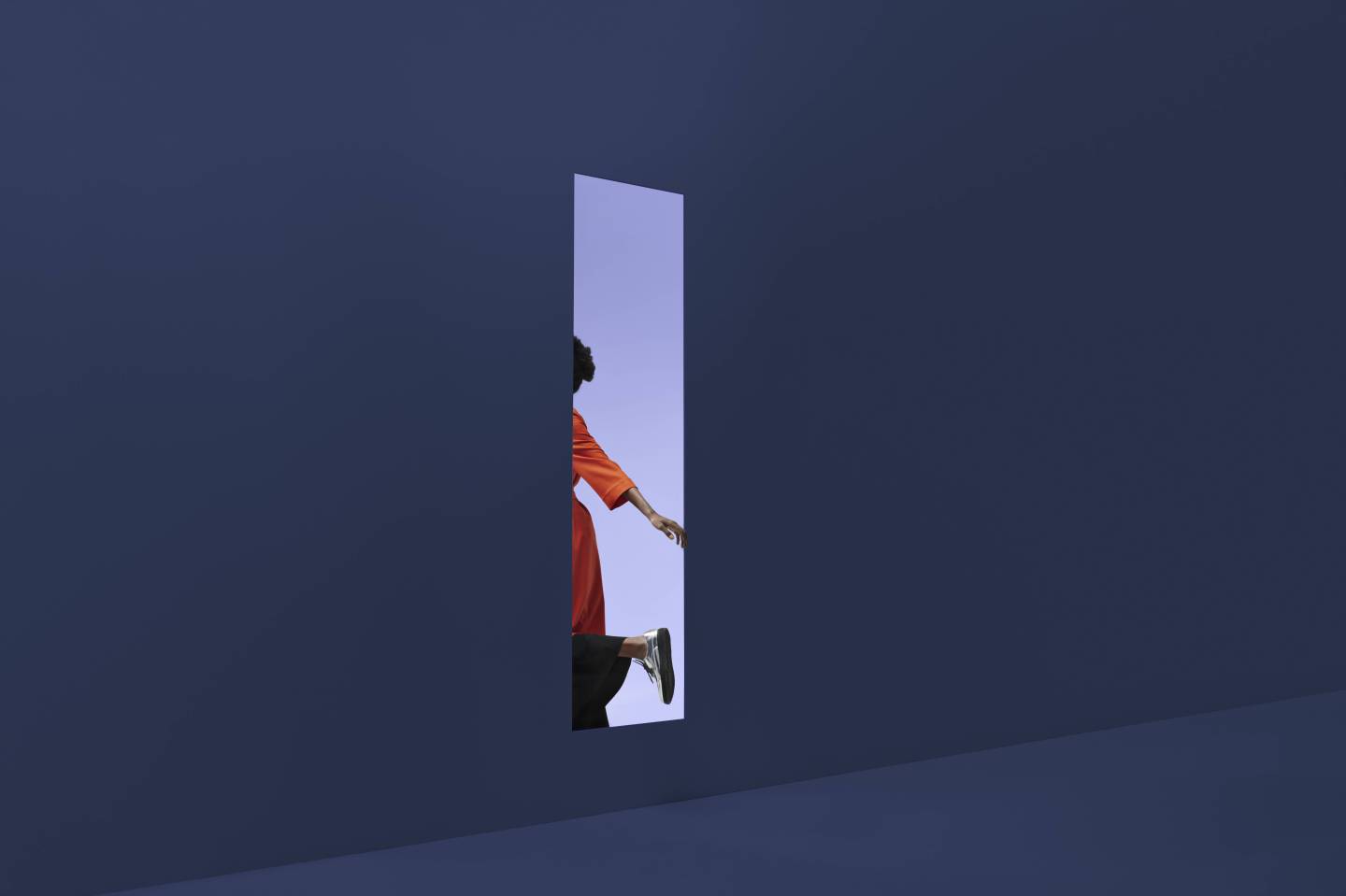 woman's arm and leg are visible as she passes through a doorway