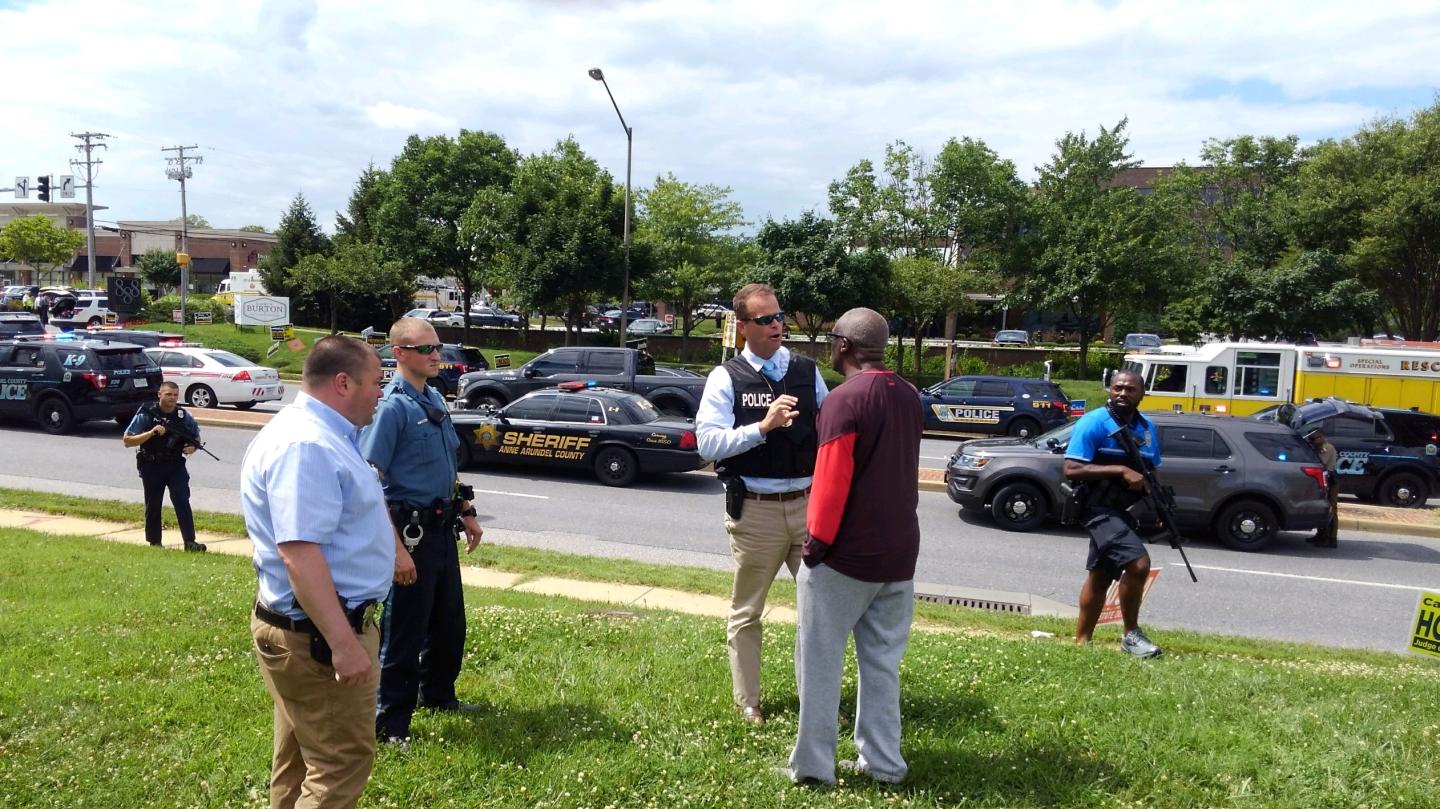 Police officers respond to an active shooter inside a city building in Annapolis