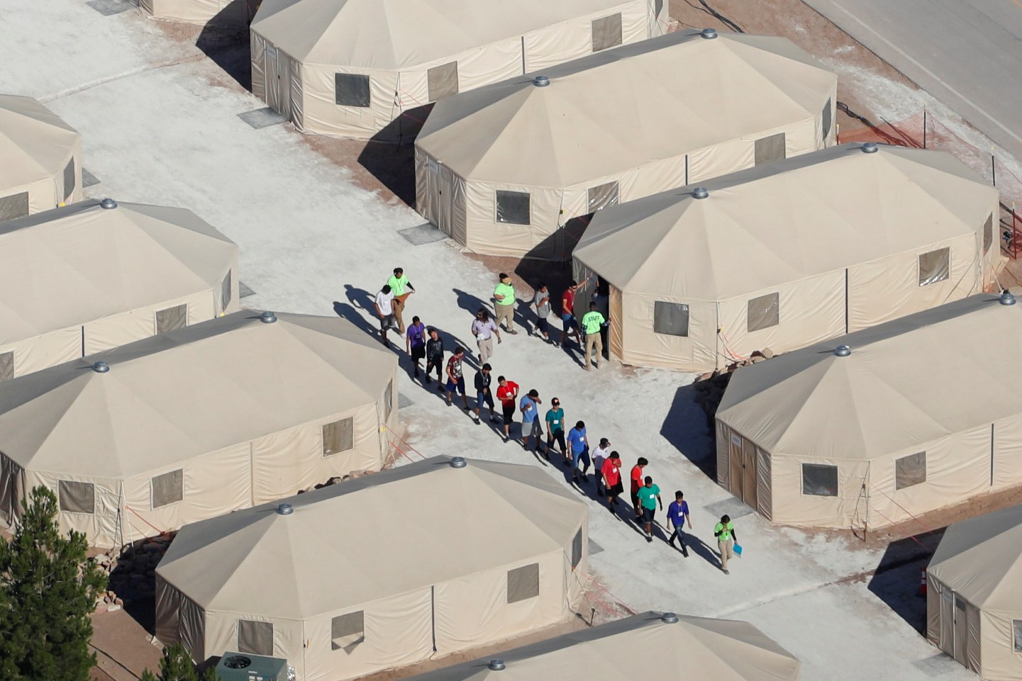 Immigrant children, many of whom have been separated from their parents under a new "zero tolerance" policy by the Trump administration, are being housed in tents next two the Mexican border in Tornillo, Texas