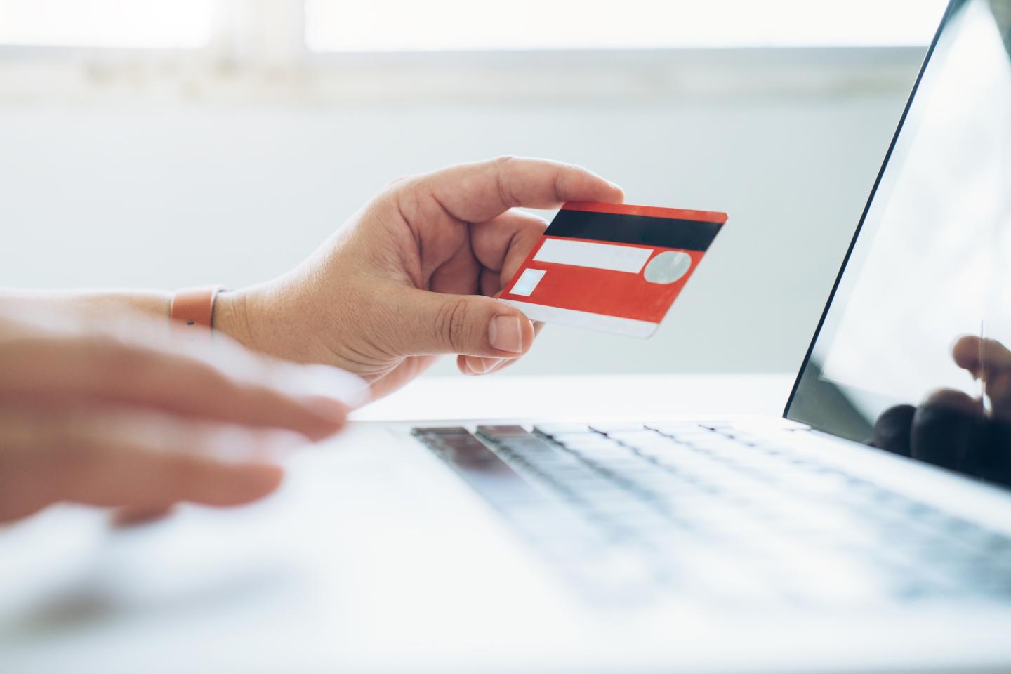 Close-Up Of Hand Holding Credit Card