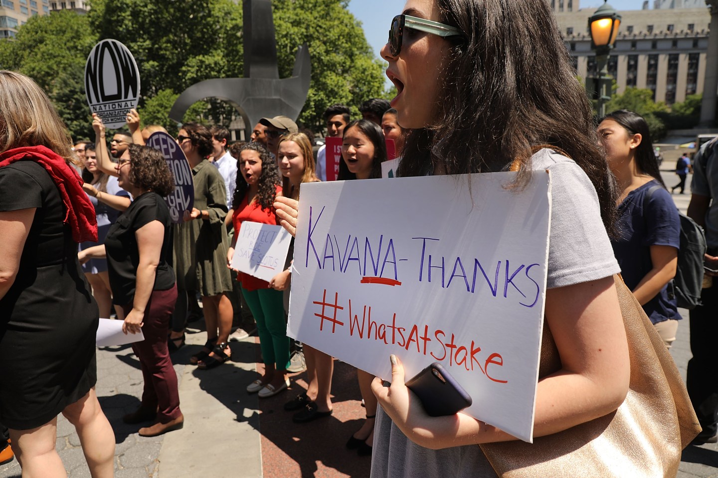 Protesters denounce President Donald Trump's selection of Judge Brett Kavanaugh as his nomination to the Supreme Court on July 10, 2018.