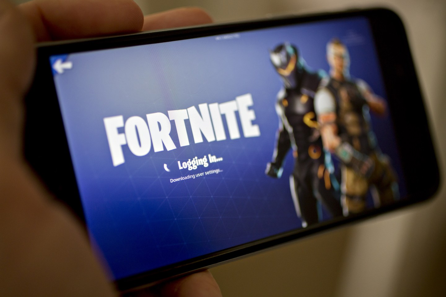 The Fortnite Battle Royale video game is displayed on an iPhone.