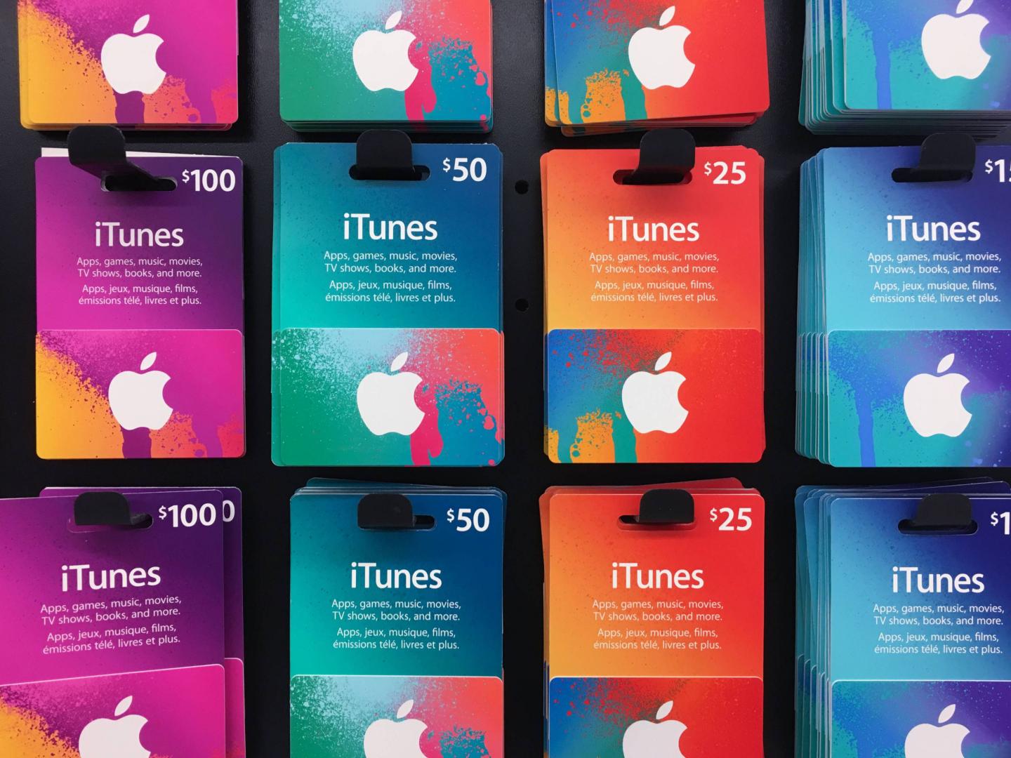 iTunes music gift cards of different values displayed for