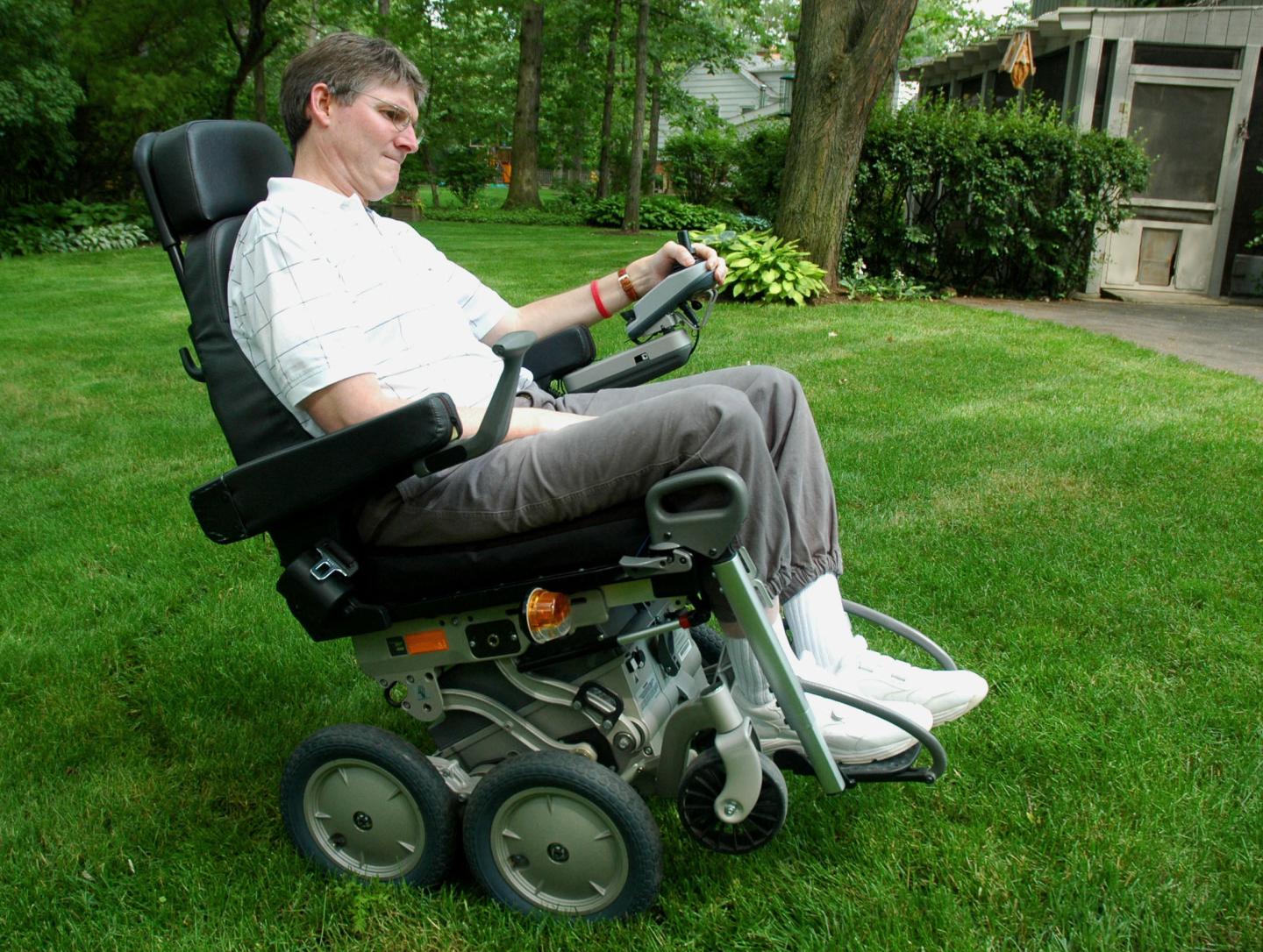Robert Gregory, 49, who suffers from multiple sclerosis, demonstrates his iBot, a high-tech wheelchair that improves mobility for the disabled, in his backyard