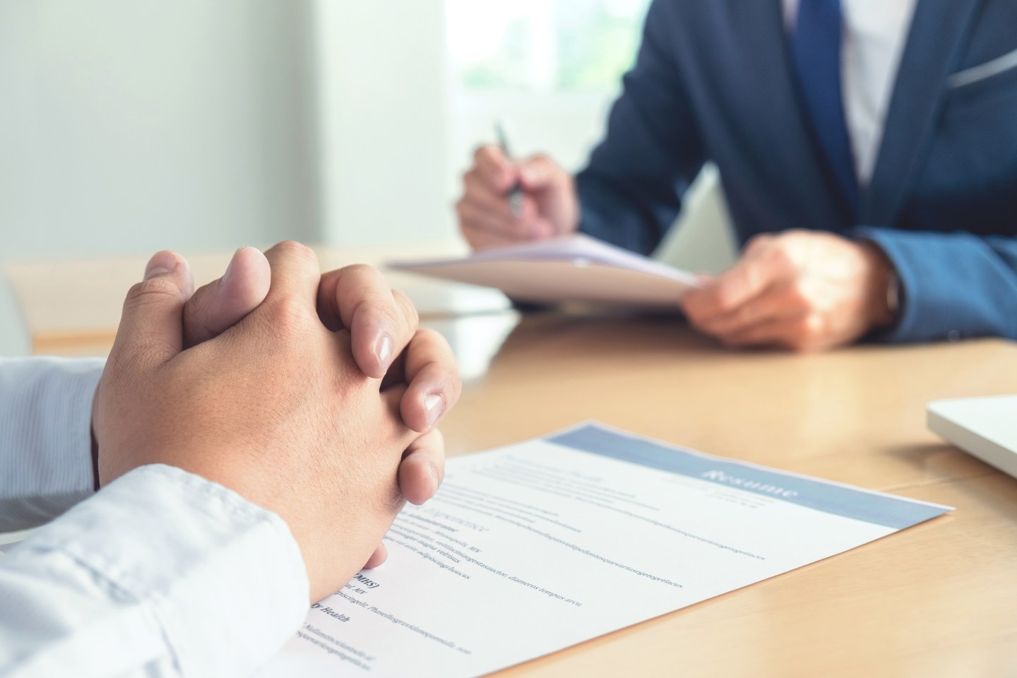 Close-Up Of Man Sitting On Table