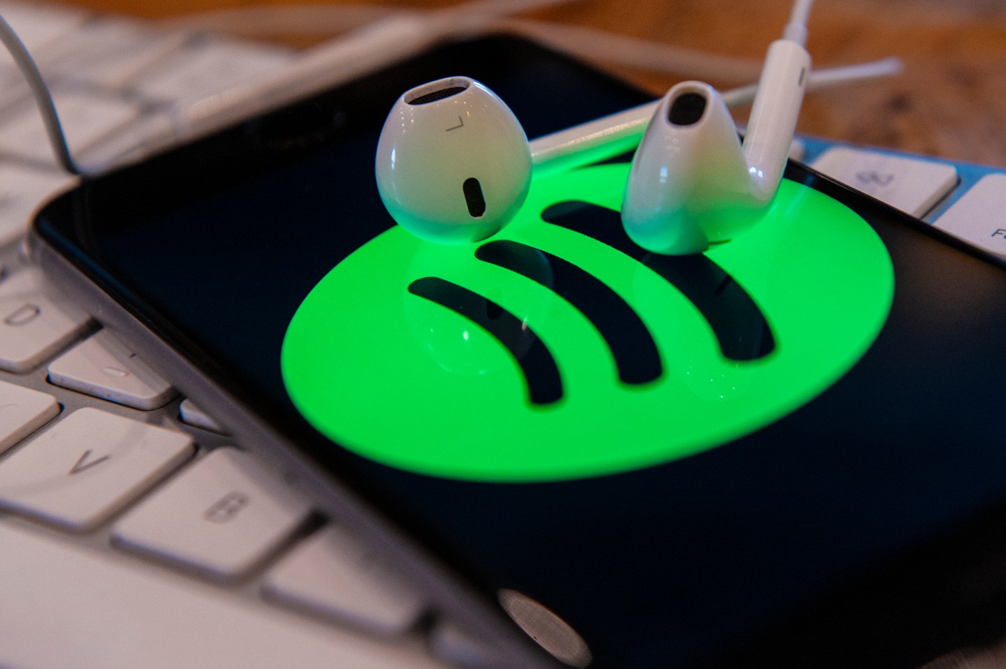 A phone with a Spotify music application is seen in this photo illustration.