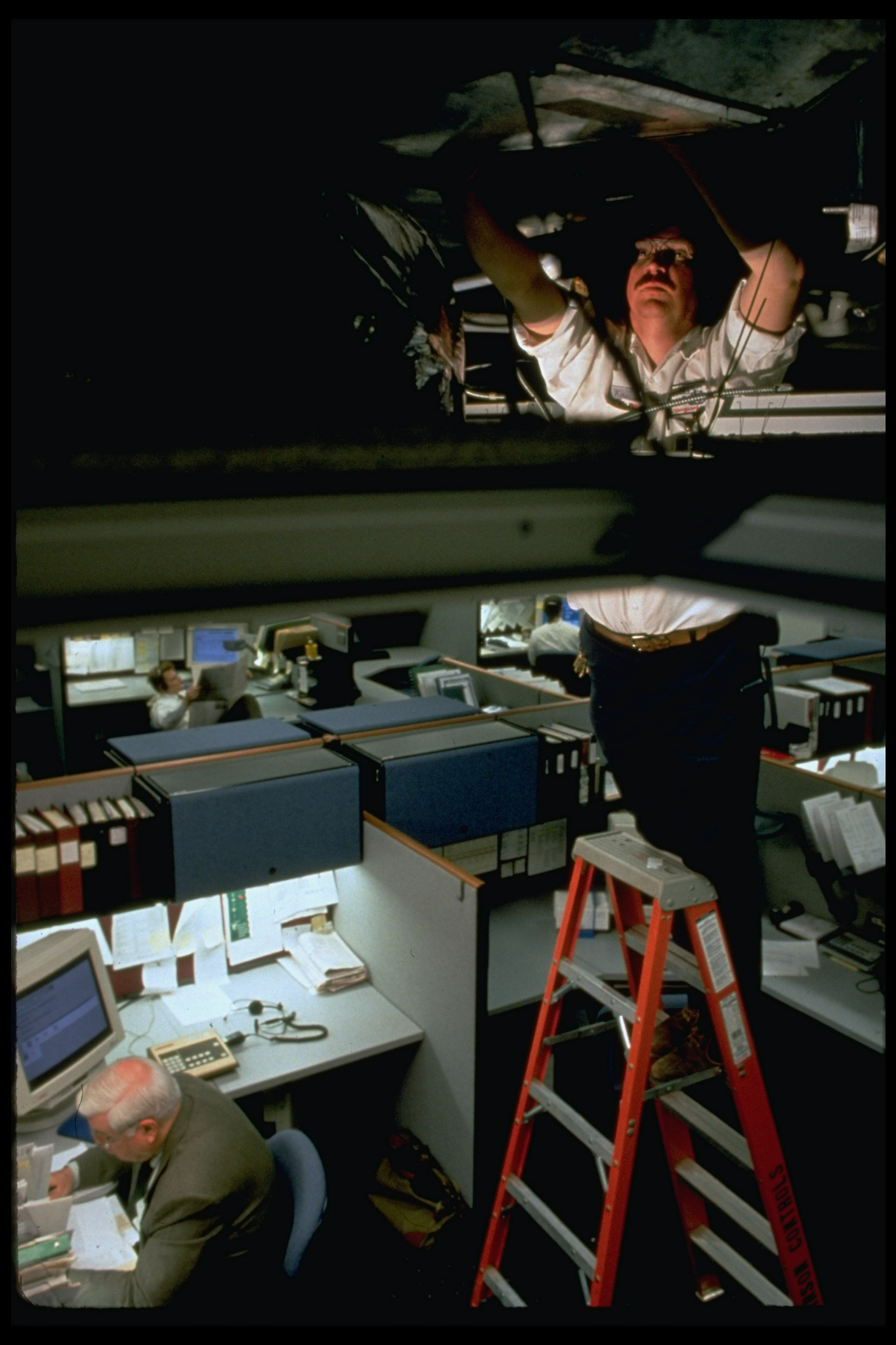 Johnson Controls worker servicing someth