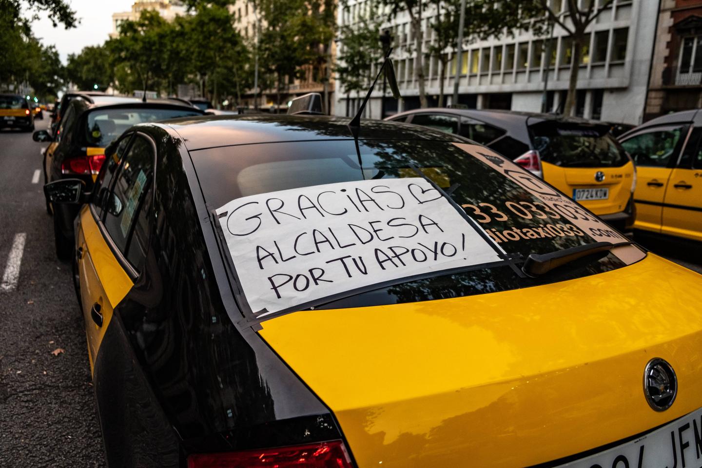A taxi with a poster saying, Thank you Mayor for your
