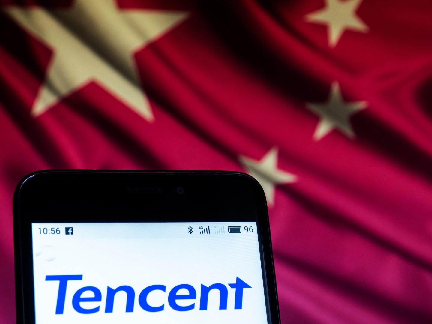 The Tencent logo seen displayed on a smart phone. According