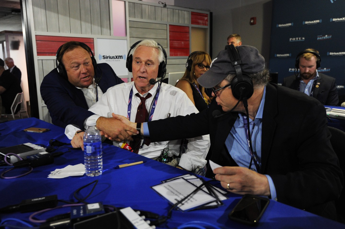 Alex Jones shakes hands with Jonathan Alter