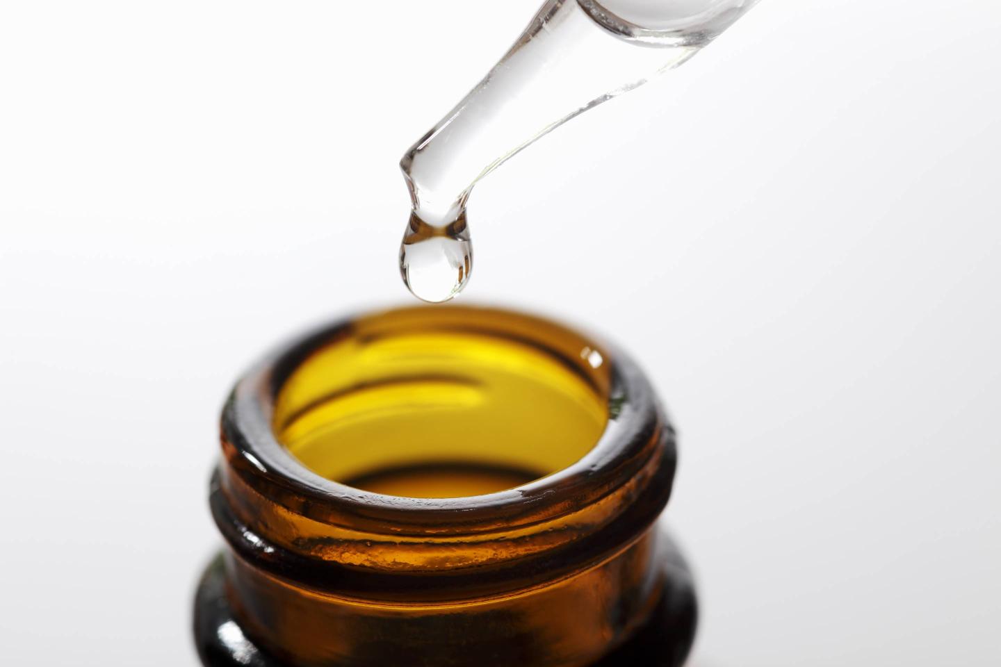 Brown herbal extraction bottle with a dropper