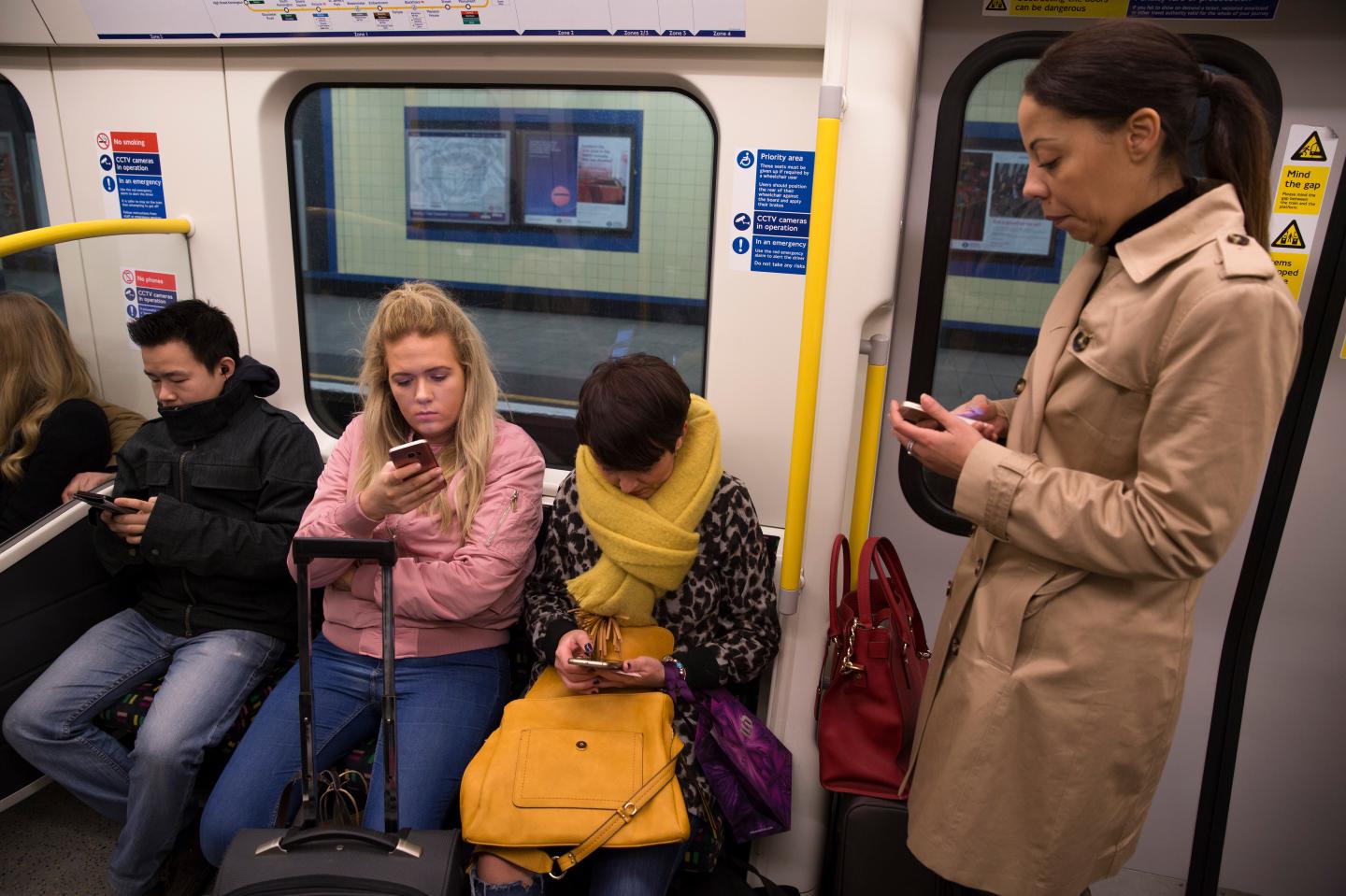 People Looking At Their Mobile Phones