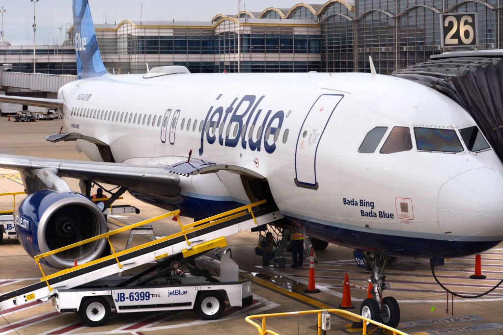 WASHINGTON, D.C. - APRIL 24, 2018:  A JetBlue Airways Airbus A320 jet is serviced at a gate at Ronald Reagan Washington National Airport in Washington, D.C. (Photo by Robert Alexander/Getty Images)