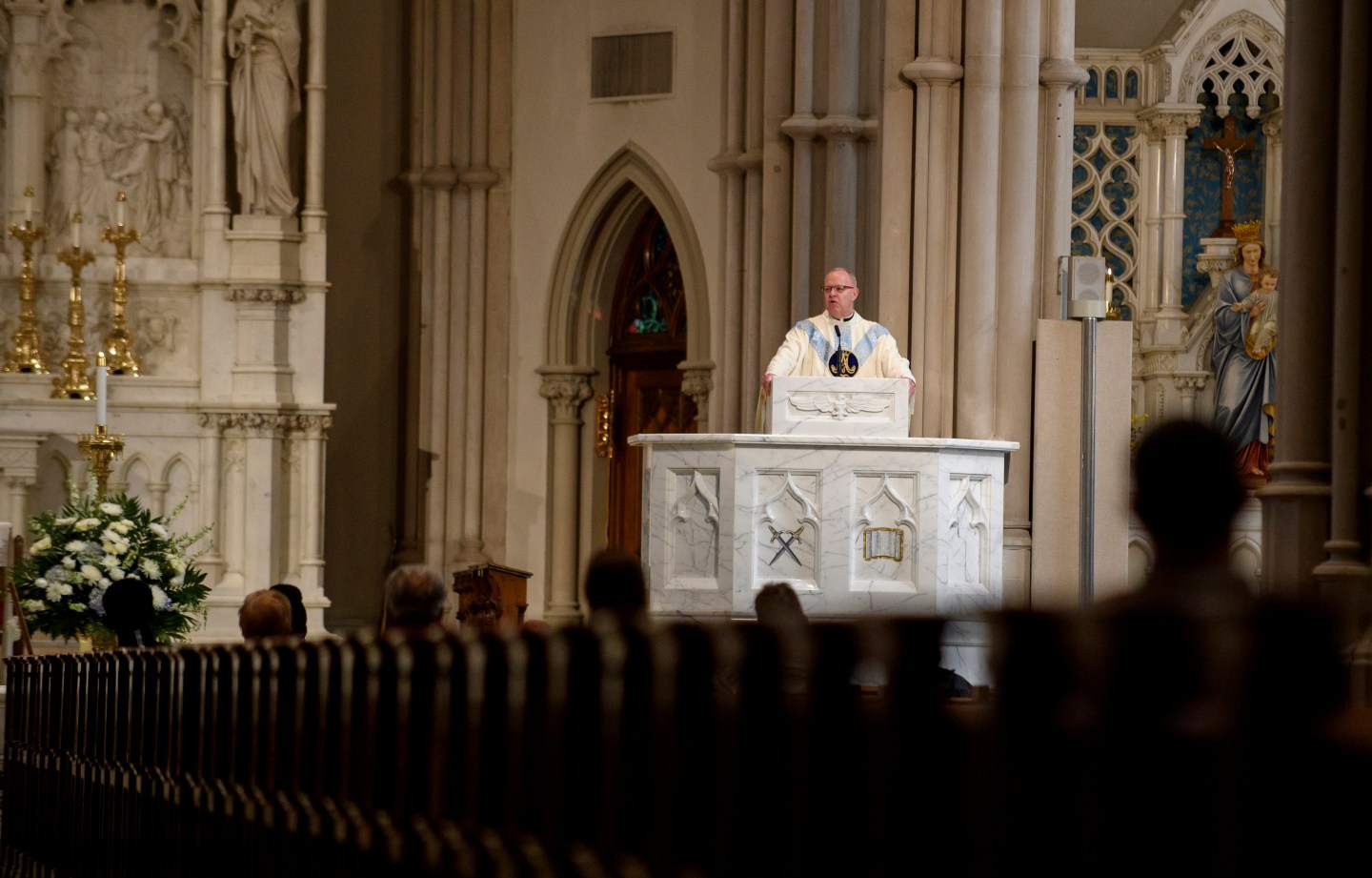 Father Kris Stubna speaks to parishioners at St. Paul Cathedral, the mother church of the Pittsburgh Diocese, on August 15, 2018, in Pittsburgh, Penn.