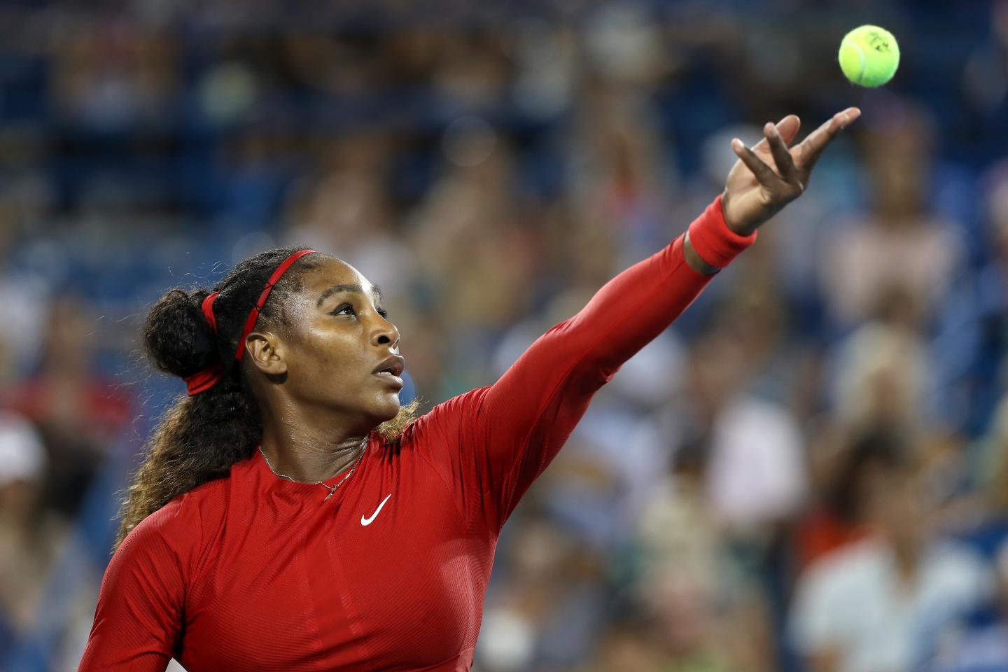 Serena Williams serves