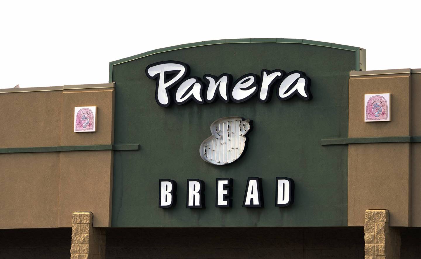 The sign on the hood of a delivery truck for Panera Bread Co. is seen in Westminster