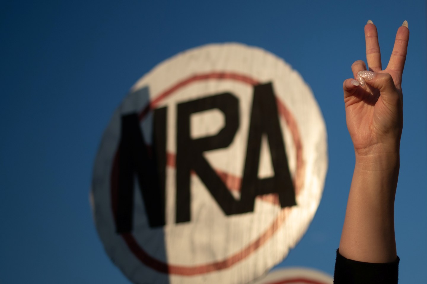 An activist takes part in protest march against NRA in Dallas, Texas