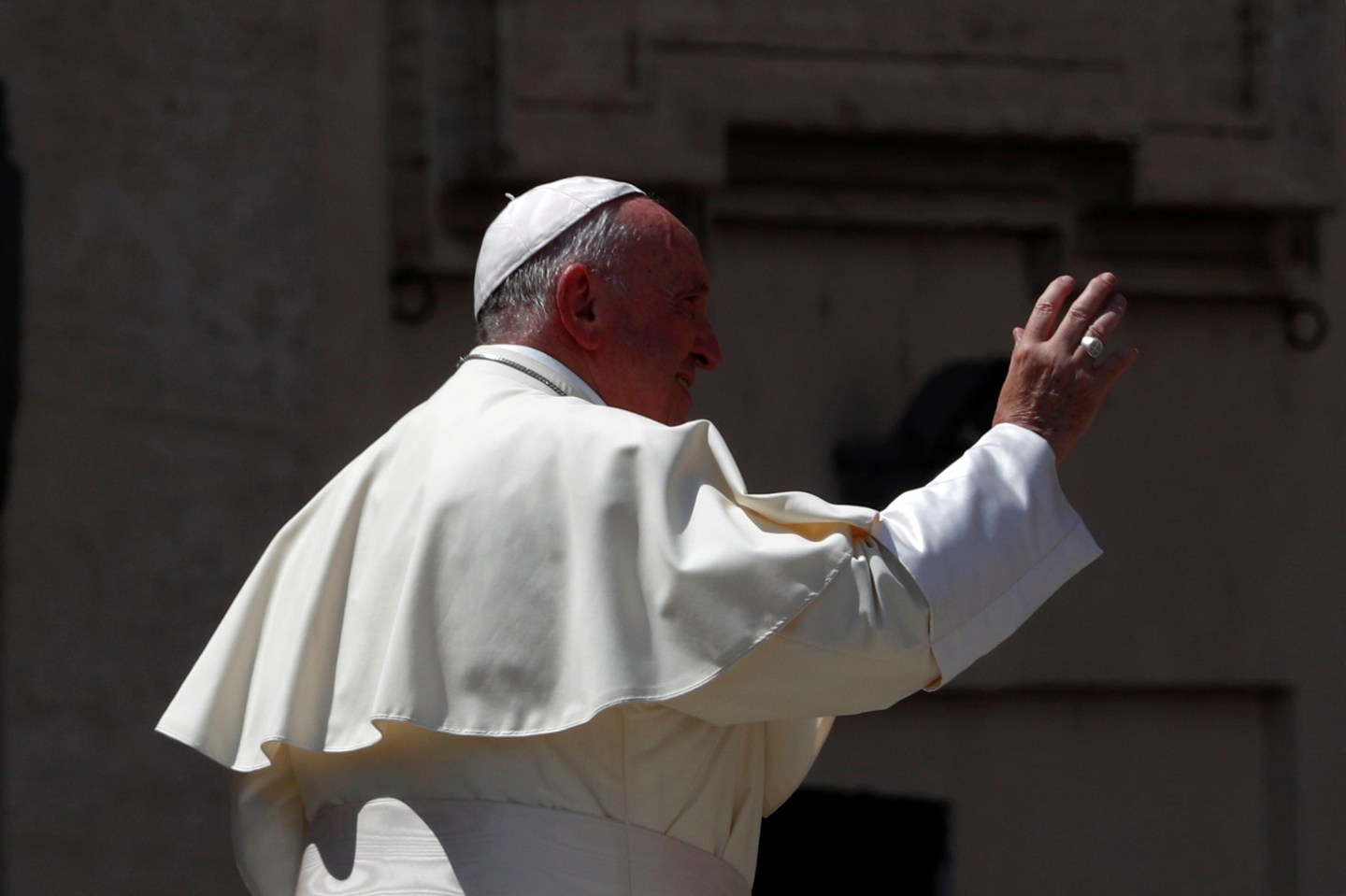 Pope Francis waves as he leaves after a meeting with Cardinal Gualtiero Bassetti in St. Peter's square at the Vatican