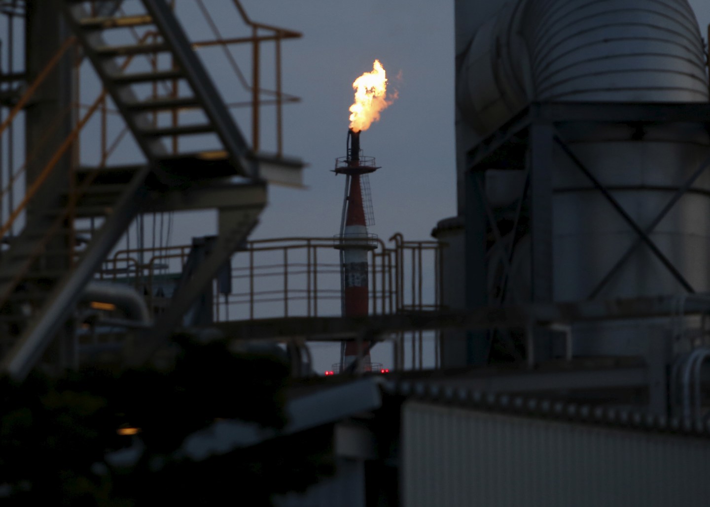 Flames shoot out of a chimney at a petrochemical plant at the Keihin industrial zone in Kawasaki
