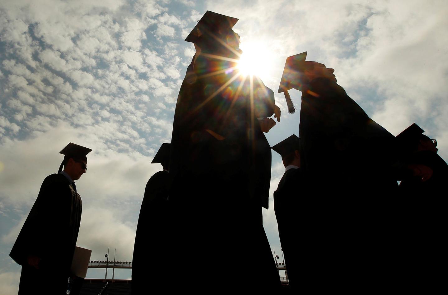 FILE PHOTO: Graduating students arrive for Commencement Exercises at Boston College in Boston
