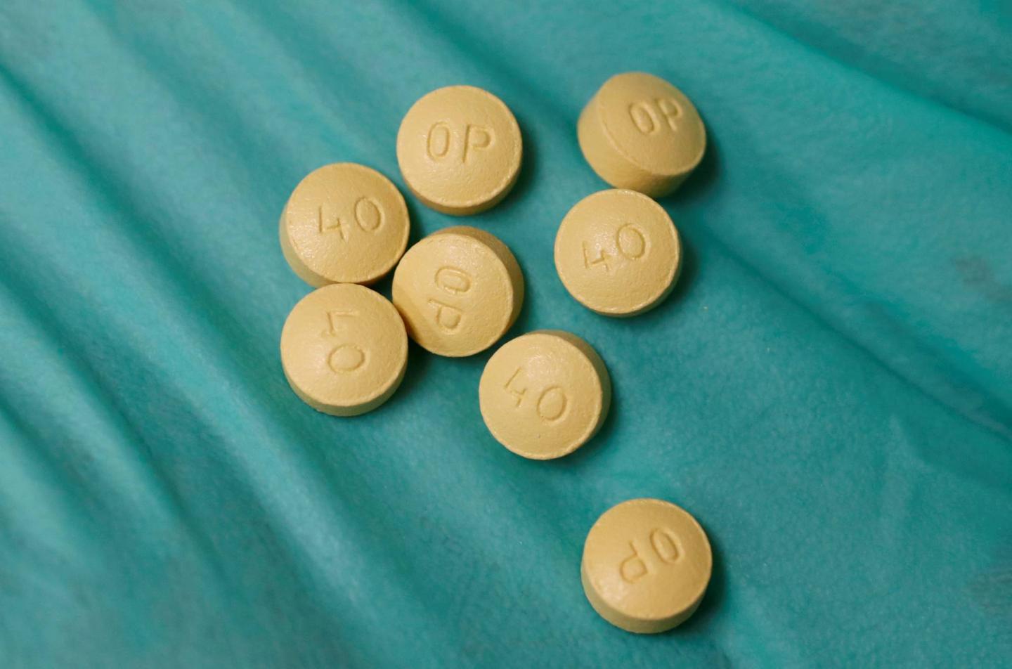 A pharmacist holds prescription painkiller OxyContin made by Purdue Pharma LP at a local pharmacy in Provo