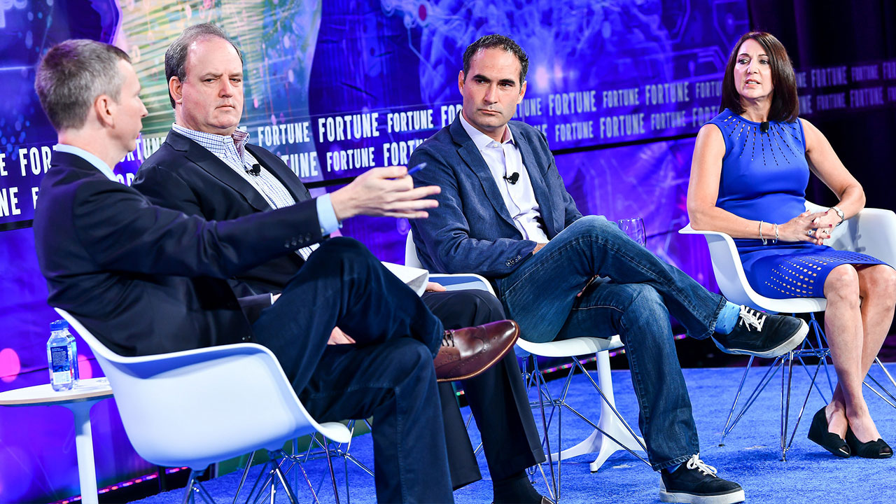 Brian O'Keefe, editor in chief of the IBM Institute for Business Value (left), interviews (from left) George Pyne, CEO of Bruin Sports Capital; Connor Schell, EVP of content at ESPN; and Debbie Spander, senior vice president of broadcast and coaching at Wasserman; during Fortune's Brainstorm Reinvent conference in Chicago on Sept. 24, 2018.