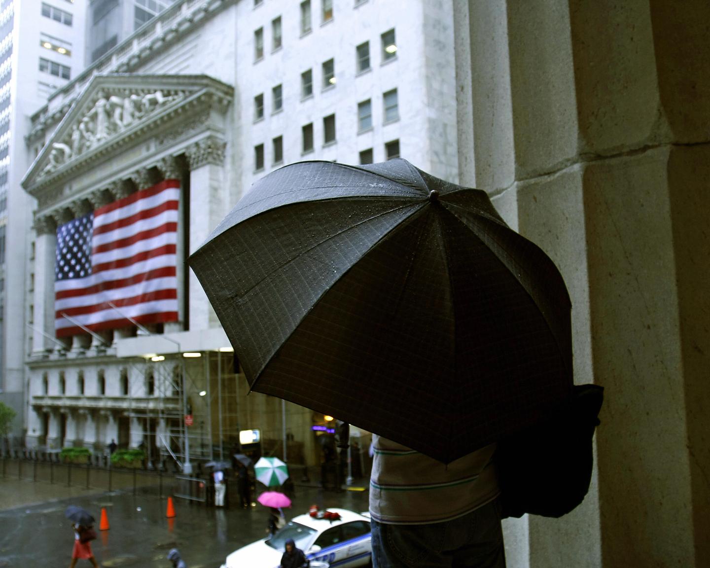 A tourist stands on the steps of Federal