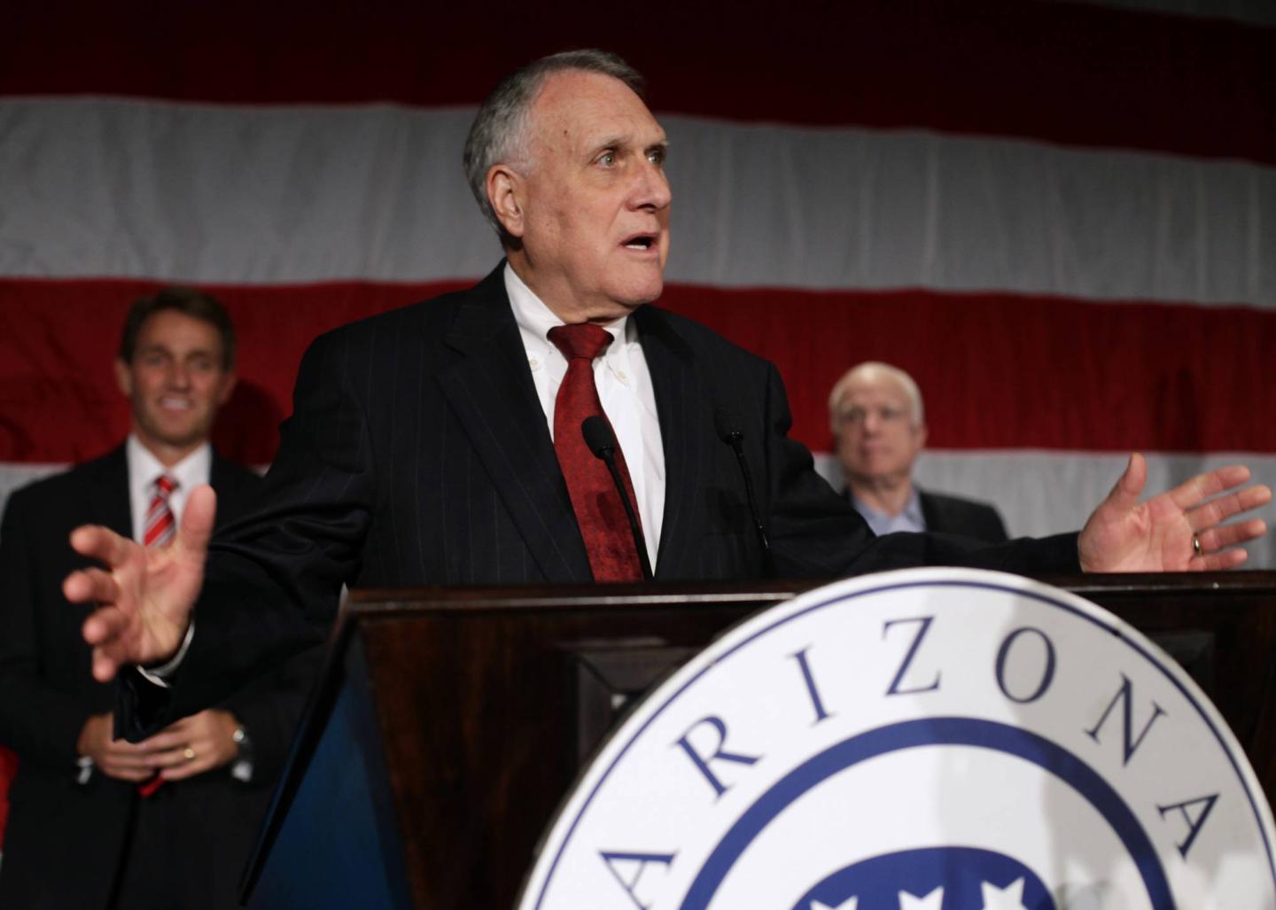 U.S. Senate Republican candidate Flake and U.S. Senator Mccain listen U.S. Senator Kyl speak during Republican Party election night event in Phoenix