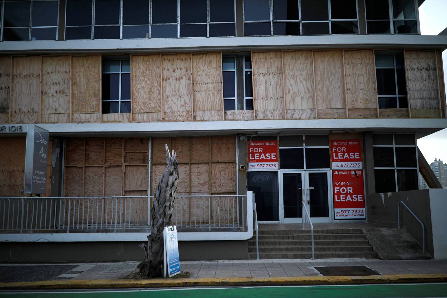 A closed business shop is seen at a touristic area of Condado, a year after Hurricane Maria devastated Puerto Rico, in San Juan