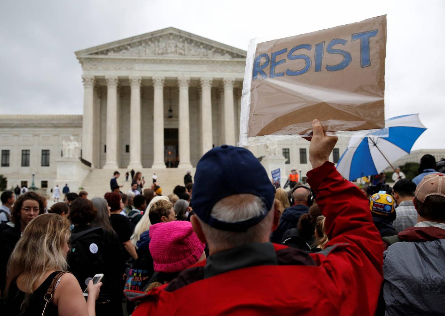 Demonstrators protest against U.S. Supreme Court nominee Brett Kavanaugh in front of the Supreme Court in Washington