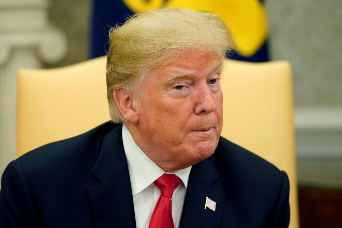 U.S. President Donald Trump answers a question about U.S. Supreme Court nominee Brett Kavanaugh during a meeting with Chilean President Sebastian Pinera in the Oval Office of the White House in Washington