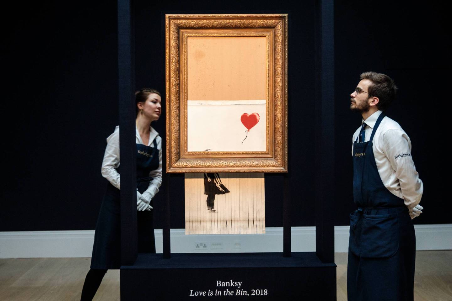 Sotheby's Unveils Banksy's Newly Completed Artwork 'Love in in the Bin'