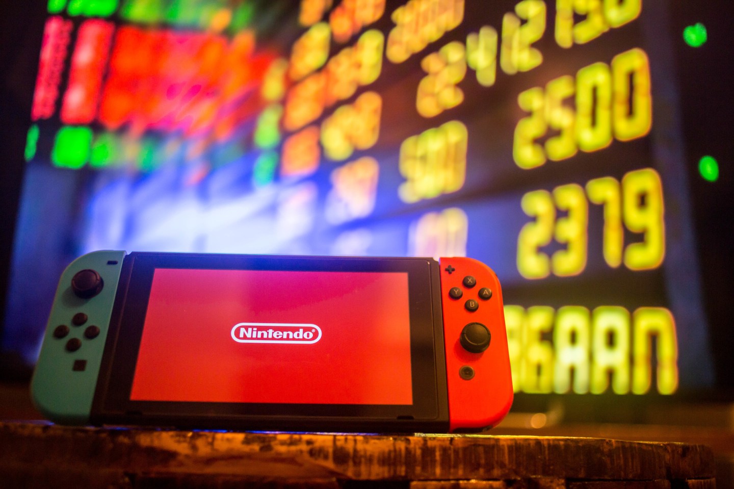 A Nintendo Switch displays the Nintendo logo with a