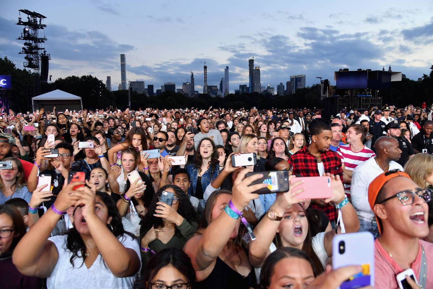 People use their mobile phones during a performance at the 2018 Global Citizen Festival