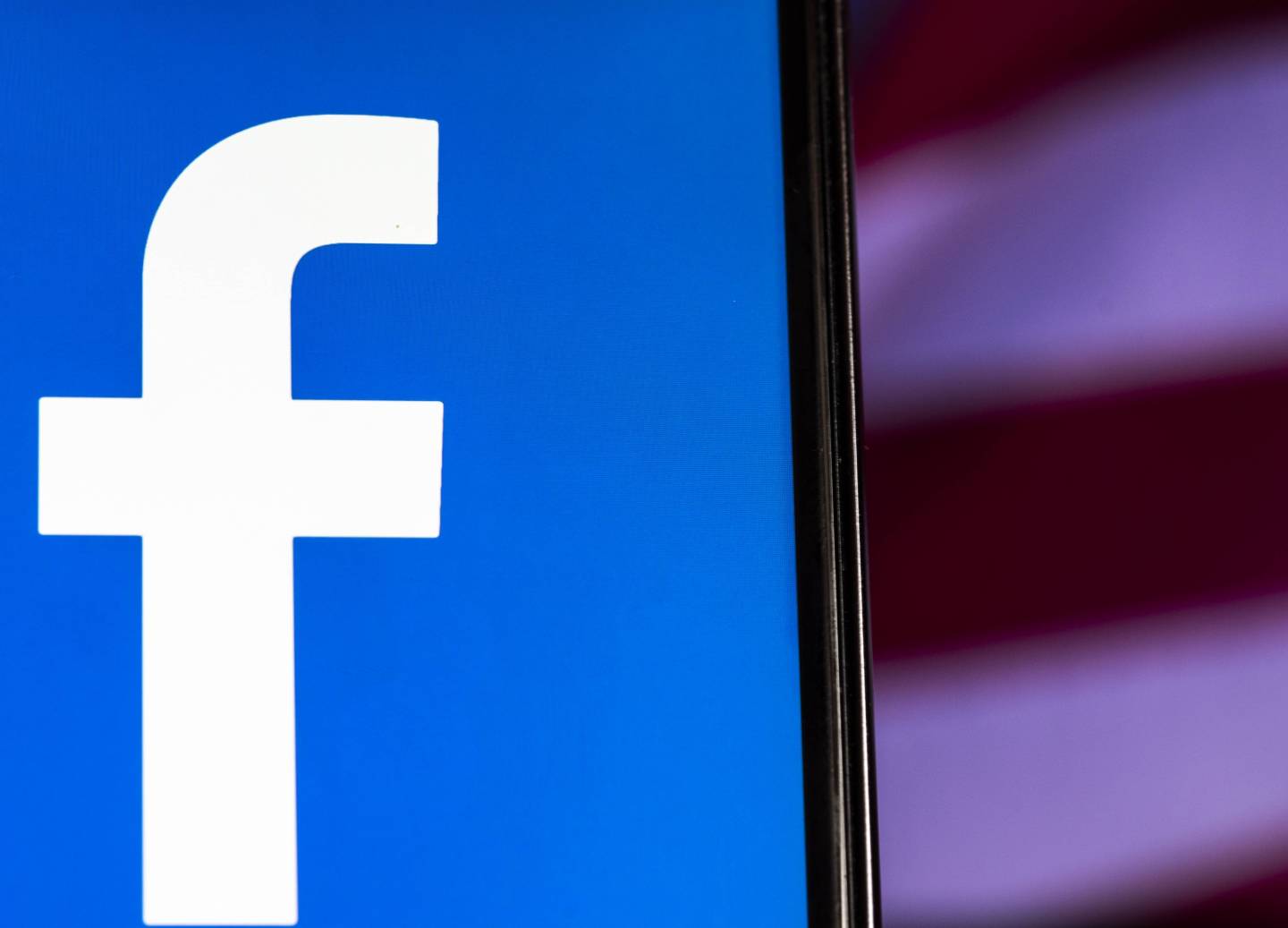 Facebook logo seen displayed on smart phone