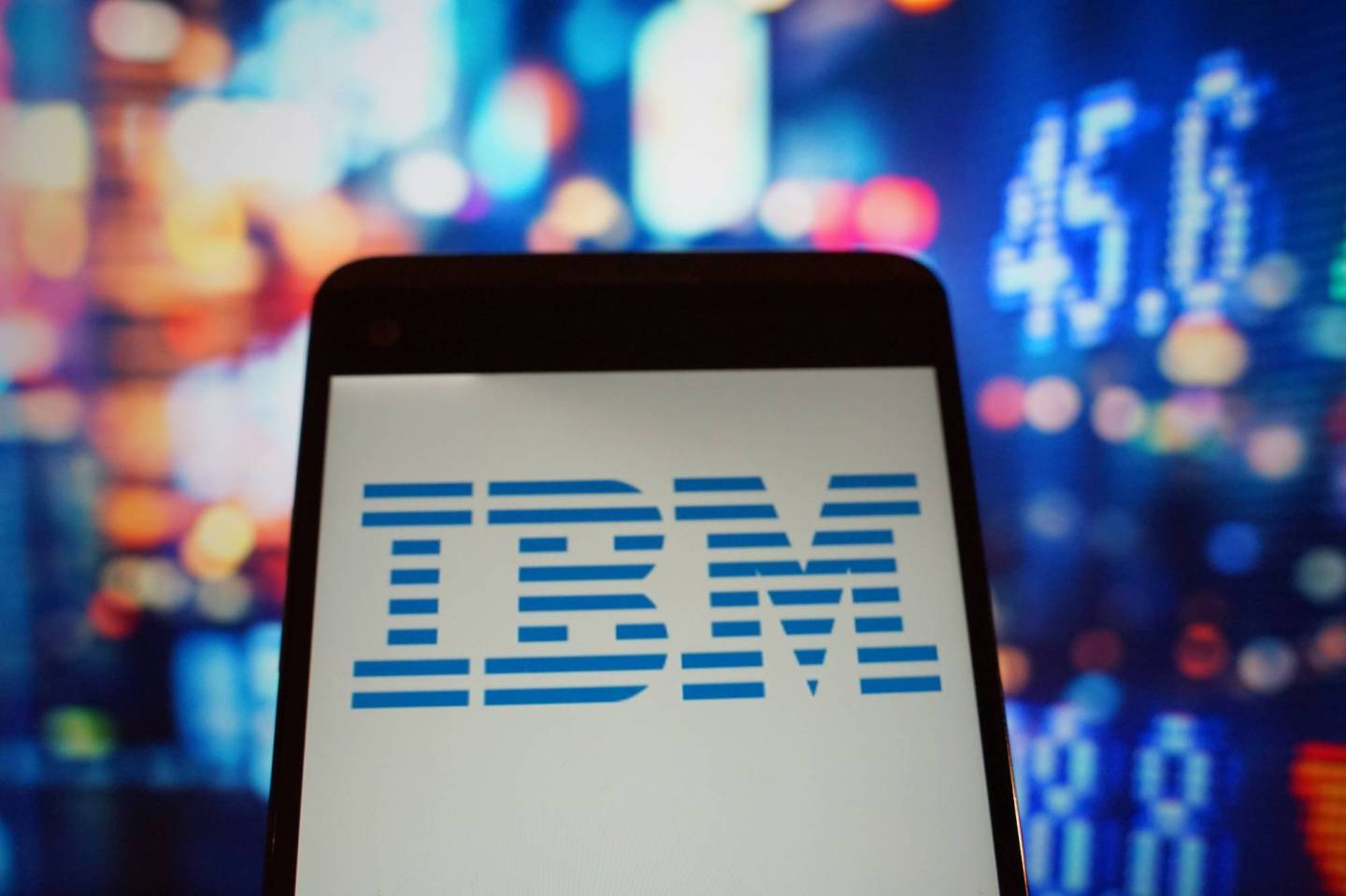 The logo of IBM is seen in a smartphone